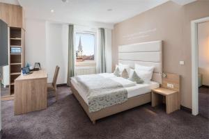 Postel nebo postele na pokoji v ubytování Best Western Hotel Lamm