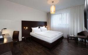 Postel nebo postele na pokoji v ubytování Best Western Hotel am Spittelmarkt