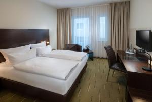 Postel nebo postele na pokoji v ubytování Best Western Hotel am Spittelmarkt