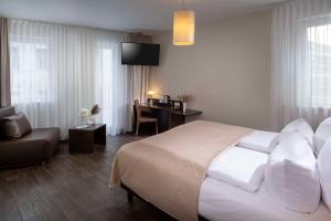 Postel nebo postele na pokoji v ubytování Best Western Hotel am Spittelmarkt
