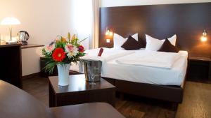 Postel nebo postele na pokoji v ubytování Best Western Hotel am Spittelmarkt