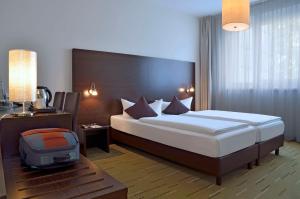 Postel nebo postele na pokoji v ubytování Best Western Hotel am Spittelmarkt