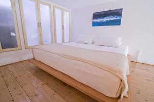 Postel nebo postele na pokoji v ubytování FOTEINI RESIDENCE