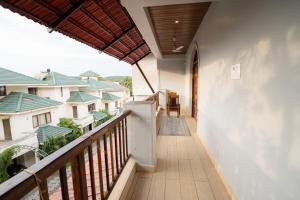 a balcony with a view of some buildings at Mogvilla 10bedrooms super luxurious, marna, siolim in Marna