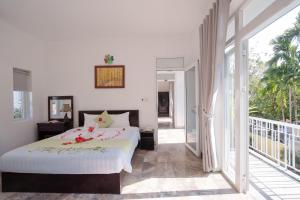 Postel nebo postele na pokoji v ubytování Tranquil Lucky Leaf Villa
