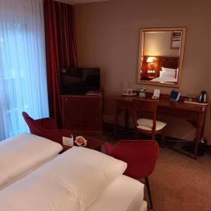 Postel nebo postele na pokoji v ubytování Schwarzwaldhotel Sonne