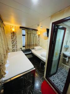 Giường trong phòng chung tại Ranjeet Guest house