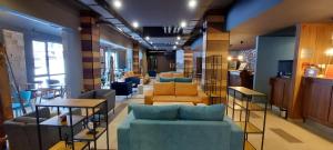 a room with couches and chairs in a store at NEAT STUDIOS in "BOROVETS GARDENS" hotel in Borovets