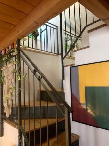 a staircase with a flat screen tv in a house at Casa di Leo in Morbegno