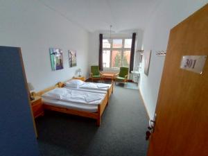 Postel nebo postele na pokoji v ubytování Die Fabrik - Hostel