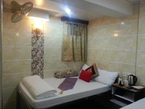 Giường trong phòng chung tại Ranjeet Guest house