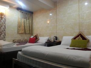 Giường trong phòng chung tại Ranjeet Guest house