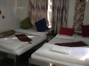 Giường trong phòng chung tại Ranjeet Guest house
