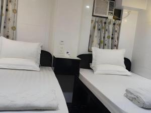 Giường trong phòng chung tại Ranjeet Guest house