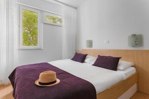 Postel nebo postele na pokoji v ubytování Hotel Slaven