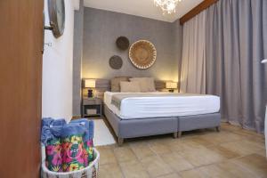 Ένα ή περισσότερα κρεβάτια σε δωμάτιο στο Villa Tropicalia