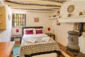 Ein Bett oder Betten in einem Zimmer der Unterkunft Cortijo Cuscurro