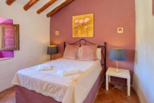 Ein Bett oder Betten in einem Zimmer der Unterkunft Cortijo Cuscurro