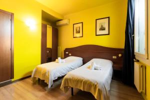 Postel nebo postele na pokoji v ubytování Hotel La Terrazza