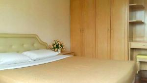 a bedroom with a bed and a dresser at Star Regency 2 Rooms Apt, Brinchang Town in Cameron Highlands
