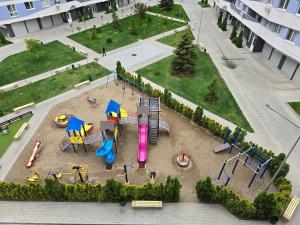 an aerial view of a park with a playground at Spacious & Cozy Apartment in Chişinău