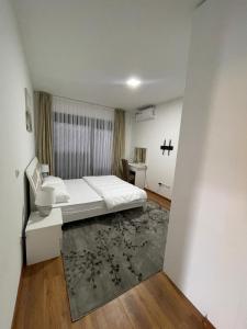 Postel nebo postele na pokoji v ubytování pazaric residence