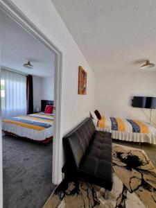 Postel nebo postele na pokoji v ubytování Cedar Lodge Motel Hamilton