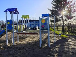 a row of playground equipment in a park at NEU! Ferienwohnung Überblick in Ganzlin