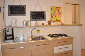 Kuchyň nebo kuchyňský kout v ubytování Zuppetta16 Apartments