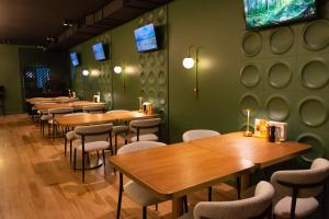 a row of tables and chairs in a restaurant at Kremin Hotel in Kremenchuk