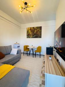 a living room with a couch and a table at Jay Homes - Naiva Heights in Naivasha