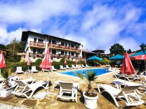 a resort with lounge chairs and a swimming pool at Family Complex KrisBo in Donkovtsi