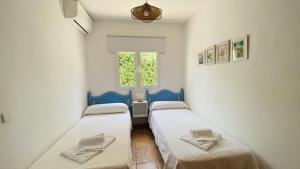 Postel nebo postele na pokoji v ubytování Villa Áncora