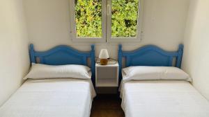 Postel nebo postele na pokoji v ubytování Villa Áncora