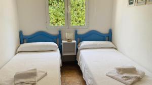 Postel nebo postele na pokoji v ubytování Villa Áncora