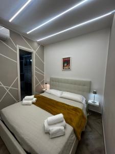 Ένα ή περισσότερα κρεβάτια σε δωμάτιο στο Nalusa Superior Chiaia - nel cuore della citta