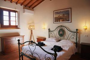 a bedroom with a bed with teddy bears on it at Lovely 6 bed Tuscan Farmhouse in Villamagna +21 photos