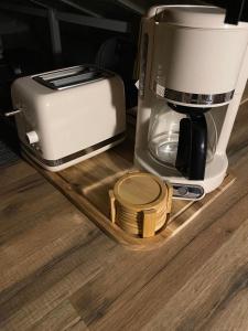 a coffee maker and a toaster on a counter at L'isménia, Le Loft in Le Gosier +17 photos