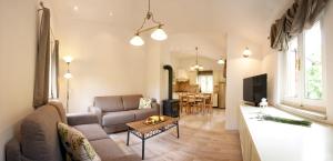 a living room with a couch and a table at Apartments Beni in Matulji