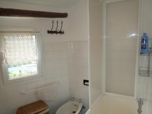 a white bathroom with a toilet and a shower at Casa Mami in Isolalunga +48 photos