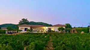 a house in the middle of a field at Chateau Juliette Winery Villa Provence in Tresques