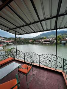 a balcony with a view of a body of water at queen villa Bukit Danau puncak cipanas in Cipanas