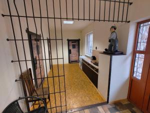 a room with a kitchen with a statue on a counter at Areál SLZA in Sečovce
