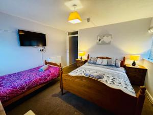 Postel nebo postele na pokoji v ubytování Le Papillon Hotel Blackpool