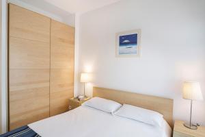 En eller flere senge i et værelse på Isaresidence Holiday Resort