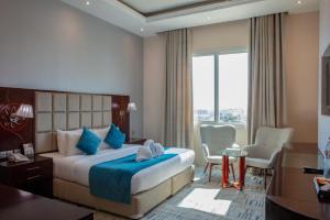 เตียงในห้องที่ Palm Inn Hotel Doha