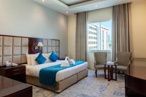 เตียงในห้องที่ Palm Inn Hotel Doha
