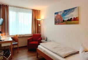 Postel nebo postele na pokoji v ubytování Heinrich Pesch Hotel + 31 fotografií