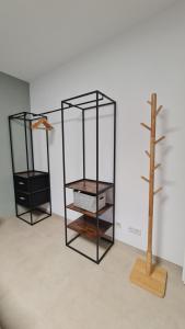 two glass shelves in a room next to a tree at Gästehaus Ferienwohnung Zimmer 2A Jülich in Jülich