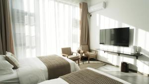 TV a/nebo společenská místnost v ubytování Dingdaer Pool B&B